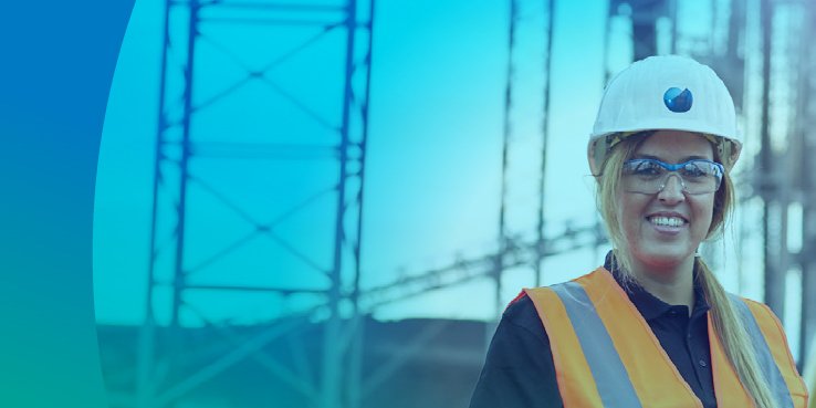 Woman with helmet and safety vest standing in front of a construction site smiling, text: Sustainability Report 2023