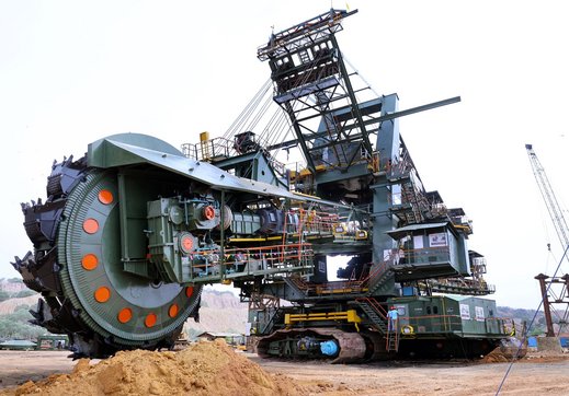 a huge Bucket-wheel excavator standing in an Indian mine.