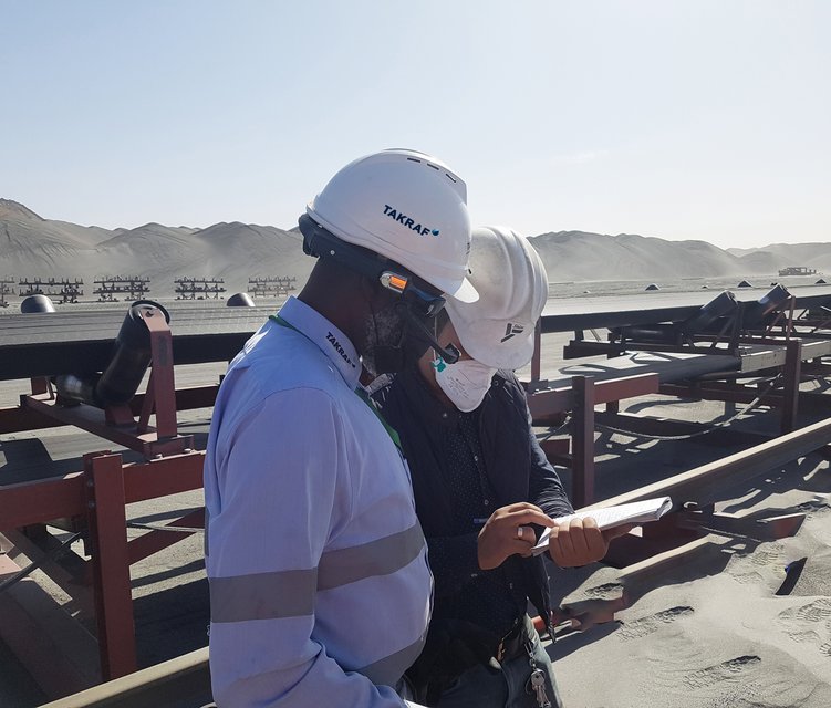 The picture shows a TAKRAF Group specialist wearing smart glasses that can connect experts in the office with maintenance or client staff in the field talking to a customer representative.