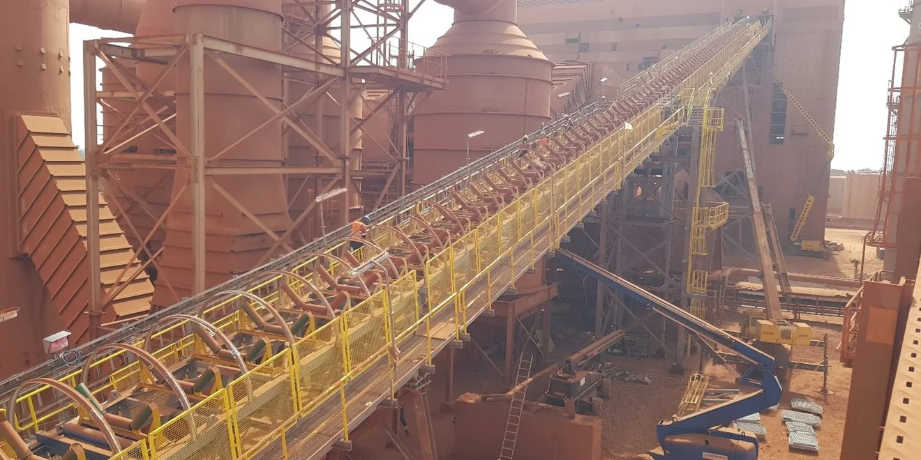 A conveyor being replaced at a brownfield project in Guinea.