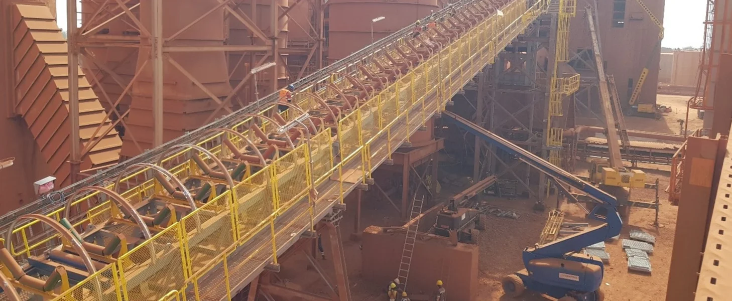 A conveyor being replaced at a brownfield project in Guinea.