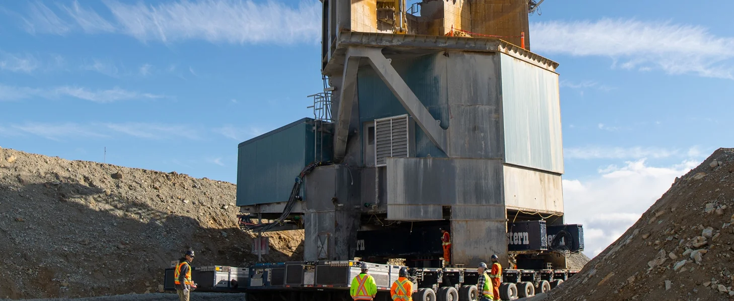 A huge crushing station is being relocated within an open-pit mine.
