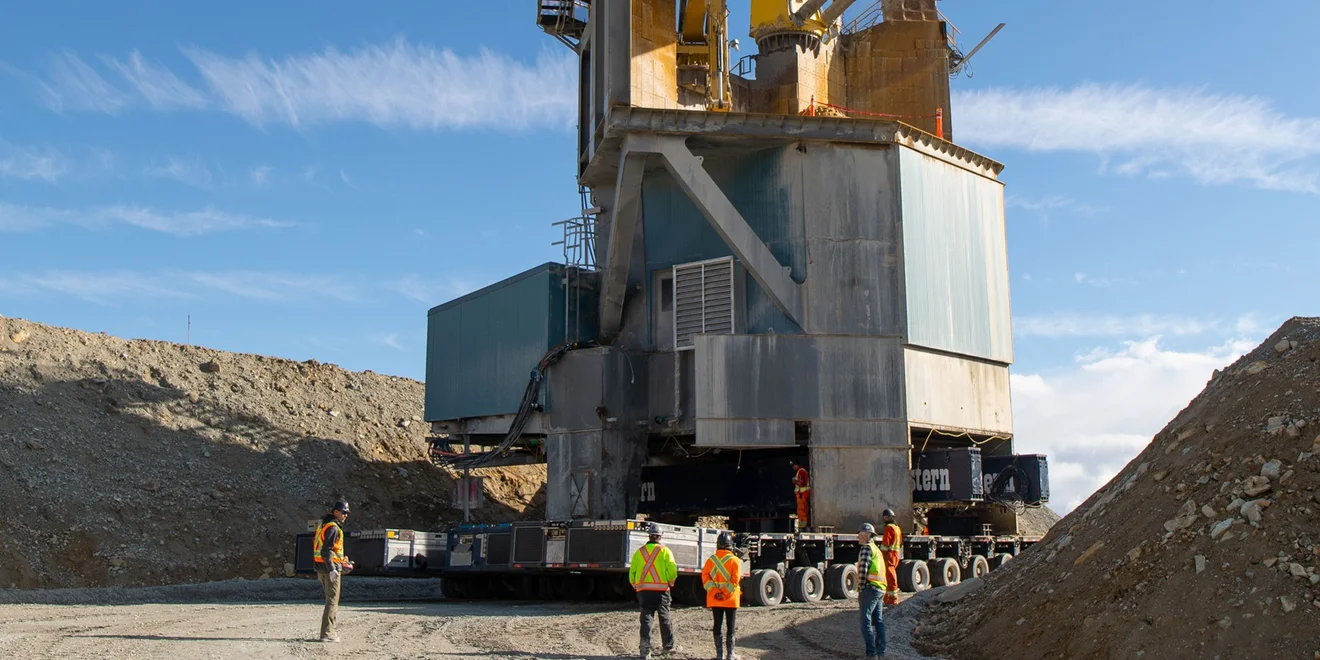 A huge crushing station is being relocated within an open-pit mine.
