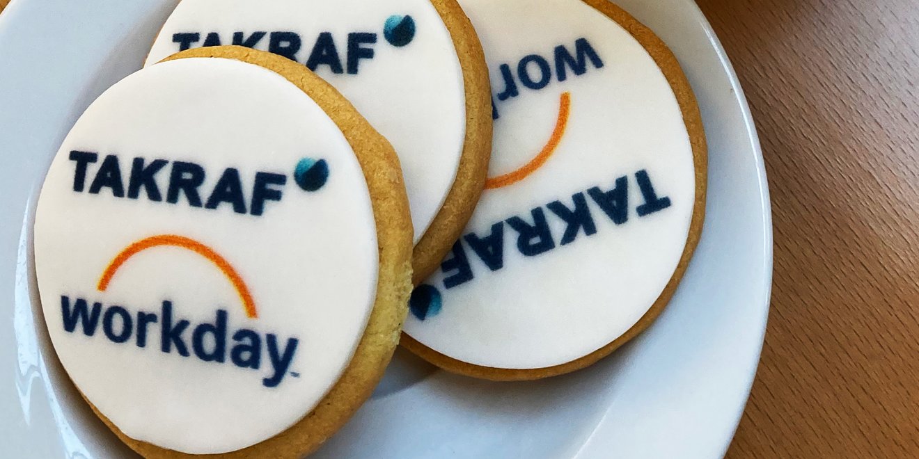 Plate of cookies with icing and TAKRAF logo