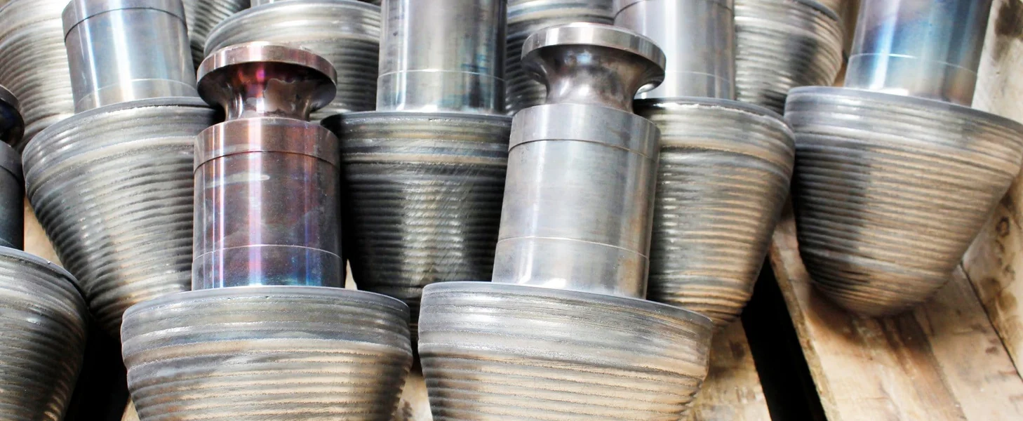 More than ten completed crushing teeth, now waiting to be used in a TAKRAF Sizer.