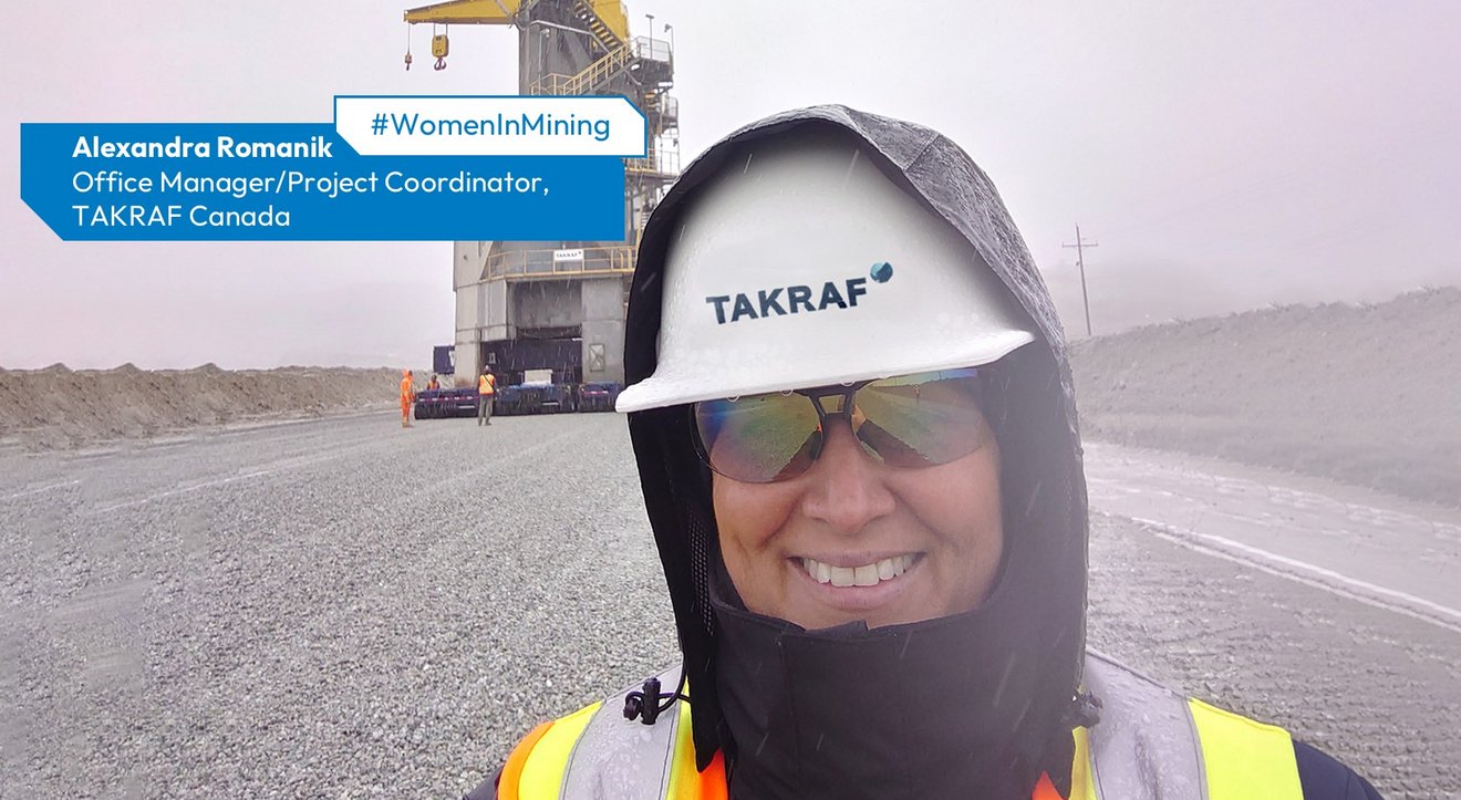 Alexandra Romanik on site in Canada - supporting safe operations and project execution. A woman with a helmet within a mining area. Her head is covered with a scarf to protect it from dust.
