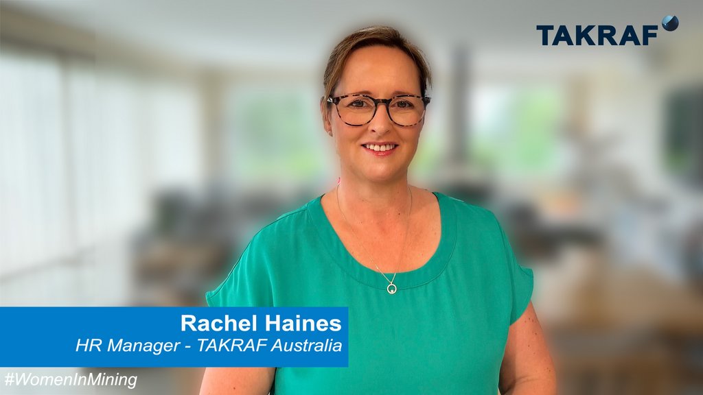 TAKRAF HR Manager, Mrs Rachel Haines is standing in an office and smiles in the camera.