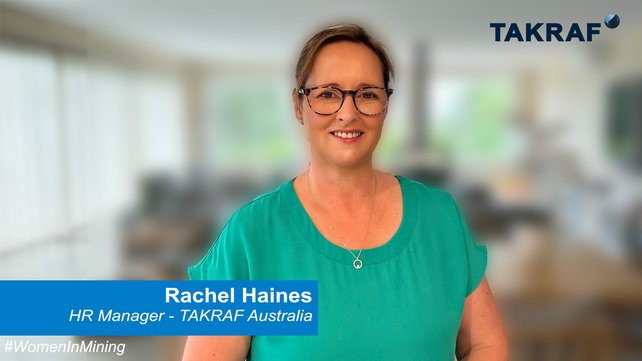 TAKRAF HR Manager, Mrs Rachel Haines is standing in an office and smiles in the camera.