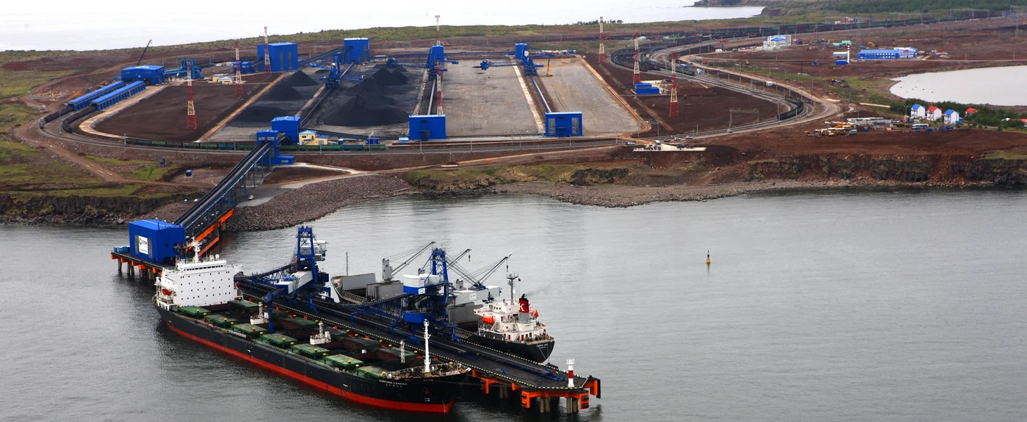 Coal export terminal incorporating TAKRAF railcar unloading system, crushing plant, stacker/reclaimer, shiploader, conveyor system and auxiliary equipment