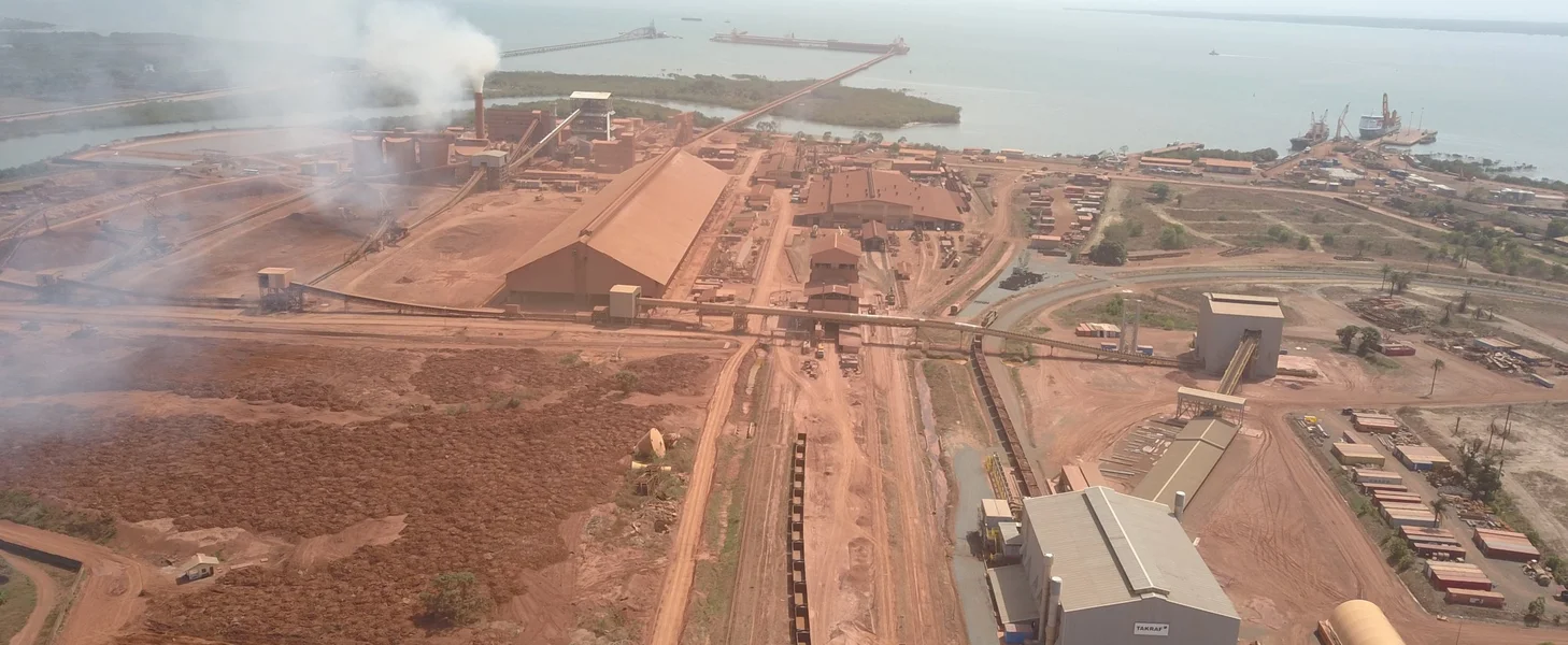 A railcar unloading and crushing and conveying system in Guinea.