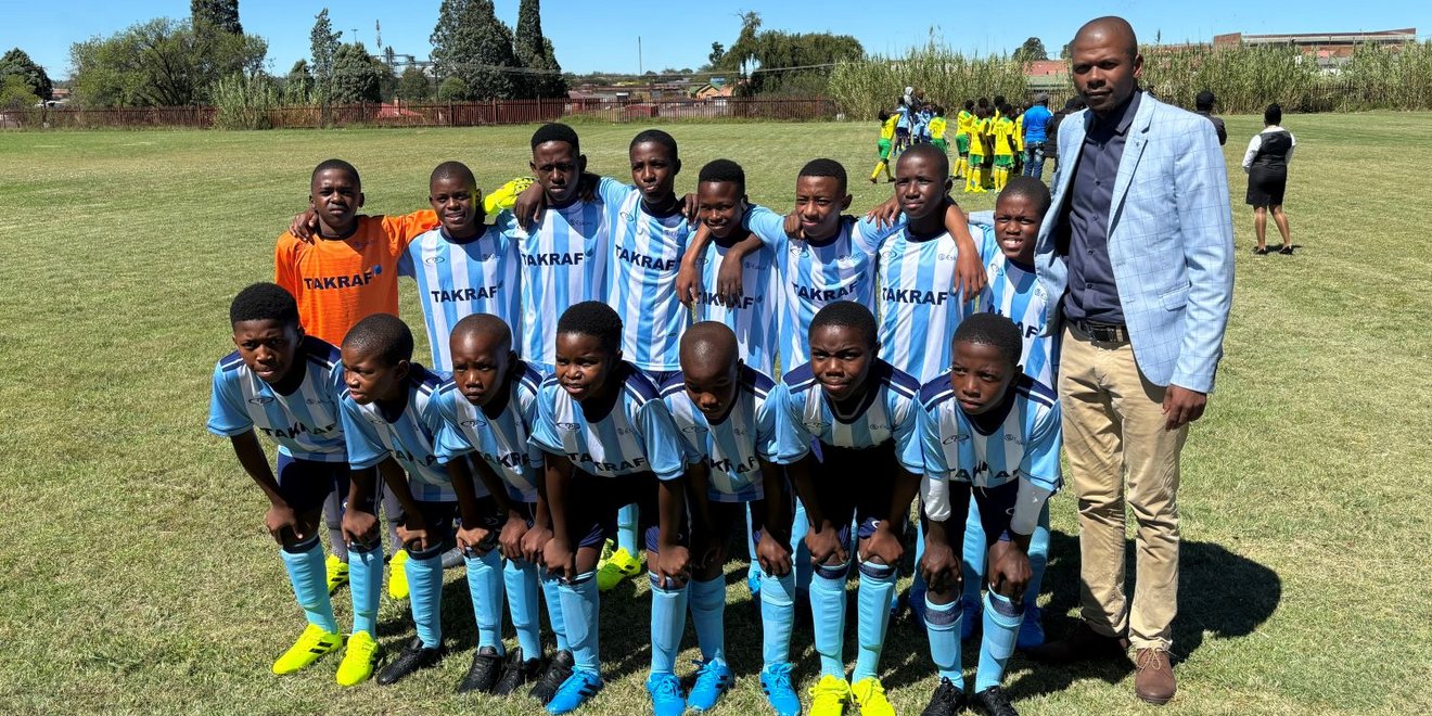 Happy students wearing the new soccer kits.