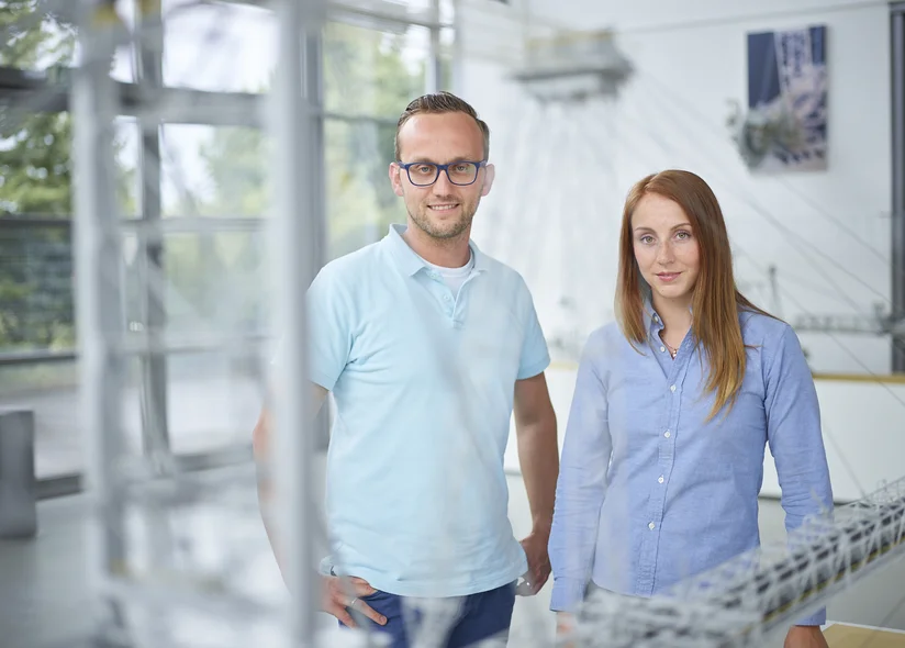 A man and a women looking into the camera