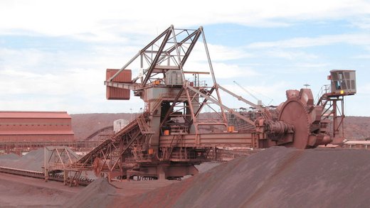 Combined bucket-wheel stacker and reclaimer for iron ore