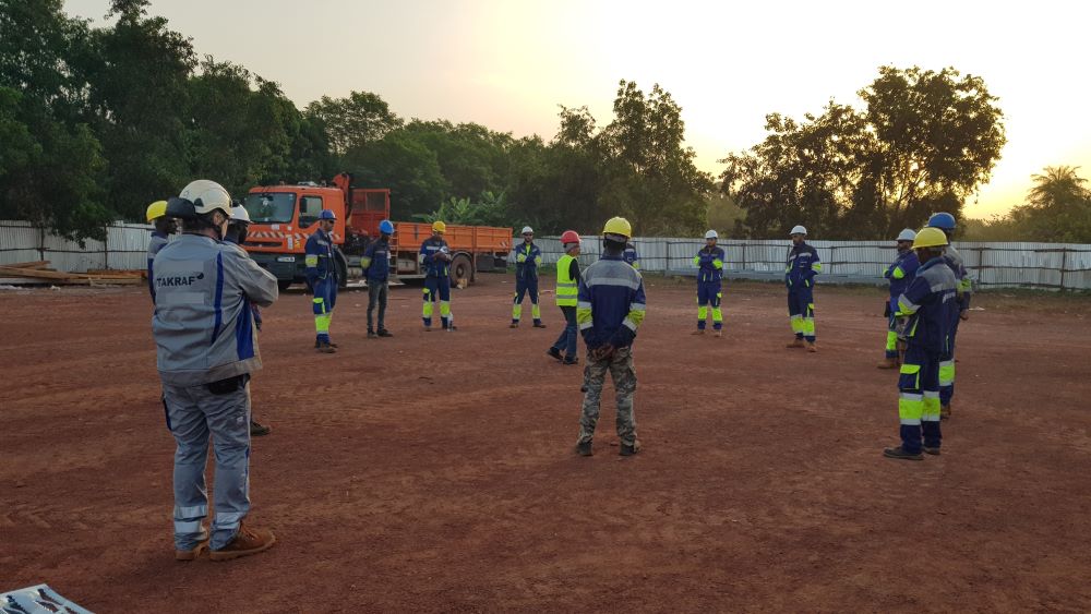 Picture shows the morning toolbox talk on site at an important TAKRAF project in Guinea.
