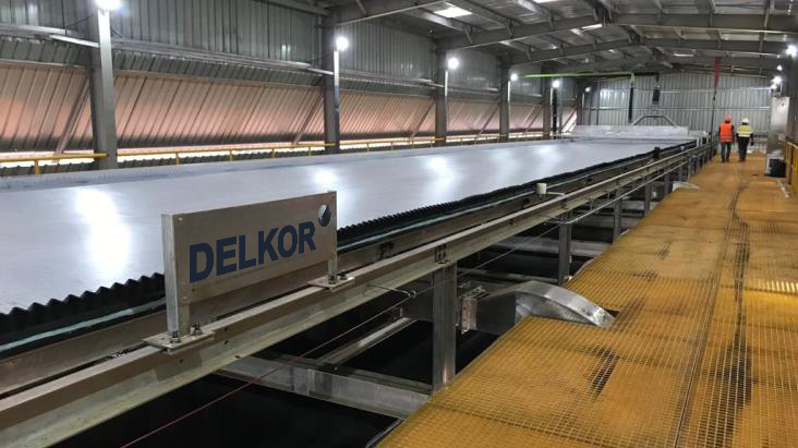 The picture shows a DELKOR Horizontal Vacuum Belt Filter for a copper processing plant in the DRC.