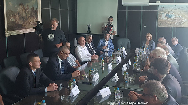 Business representatives at a conference table